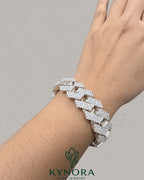 Sterling silver 18mm Moissanite diamond hip hop bracelet by Kynora Jewels with bold, polished links and sparkling gemstones.