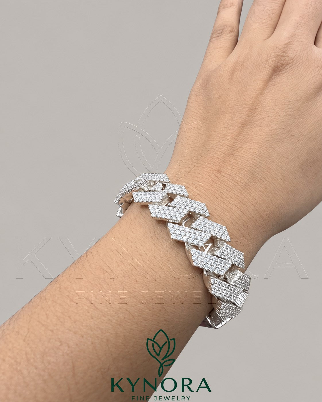 Sterling silver 18mm Moissanite diamond hip hop bracelet by Kynora Jewels with bold, polished links and sparkling gemstones.