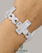 Sterling silver gold hip hop bracelet with fully iced out cross design and moissanite diamonds by Kynora Jewels.