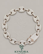 Sterling silver 12mm Moissanite diamond hip-hop bracelet by Kynora Jewels, featuring a bold, sparkling design.