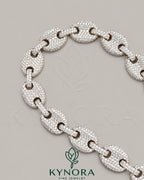 12mm Moissanite diamond sterling silver hip-hop bracelet by Kynora Jewels with bold design and sparkling stones.