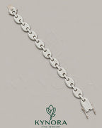 Sterling silver 12mm Moissanite diamond hip-hop bracelet by Kynora Jewels with sparkling gemstones and bold design.