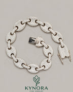 Kynora Jewels 12mm Moissanite diamond sterling silver hip-hop bracelet with bold design and sparkling stones.
