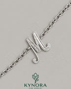 VVS Moissanite diamond "M" sterling silver anklet by Kynora Jewels, featuring hip-hop style design and intricate craftsmanship.