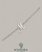 VVS Moissanite diamond "M" sterling silver anklet from Kynora Jewels featuring a hip-hop bracelet design.