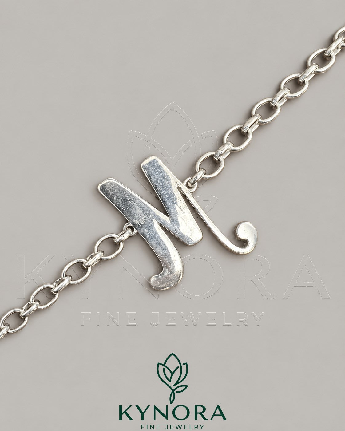 Sterling silver VVS moissanite diamond "M" anklet by Kynora Jewels, featuring a hip-hop bracelet design with sparkling gemstones.
