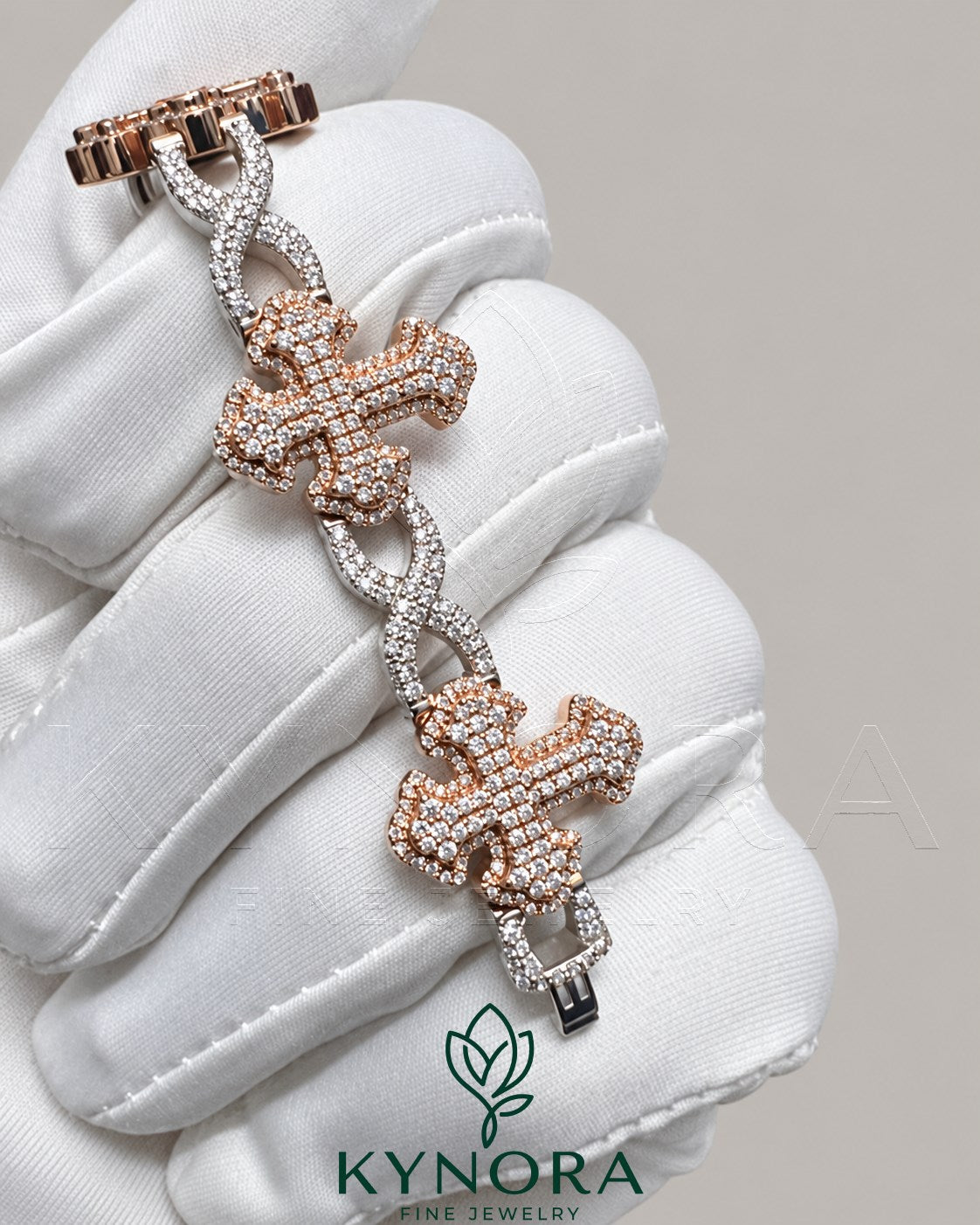 Kynora Jewels iced-out moissanite diamond cross and infinity two-tone hip-hop bracelet with sparkling gemstones and intricate design.