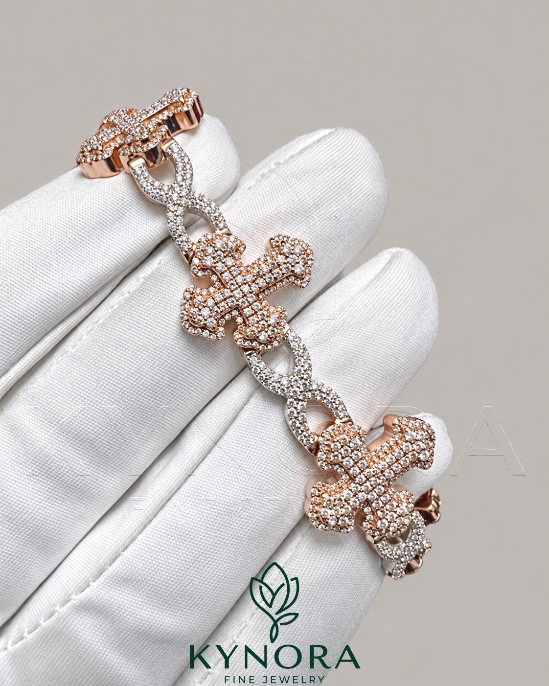 Kynora Jewels fully iced out moissanite diamond cross and infinity two-tone hip hop bracelet, sparkling jewelry piece.