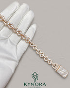 Sterling silver hip-hop bracelet with 10mm VVS moissanite diamonds and infinity design, by Kynora Jewels.