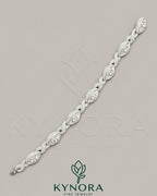 Kynora Jewels men's silver hip-hop bracelet featuring Infinity Evil Eye design with moissanite diamonds and 925 silver craftsmanship.