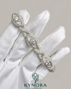 Silver men's hip-hop bracelet with infinity evil eye design featuring moissanite diamonds, crafted by Kynora Jewels.