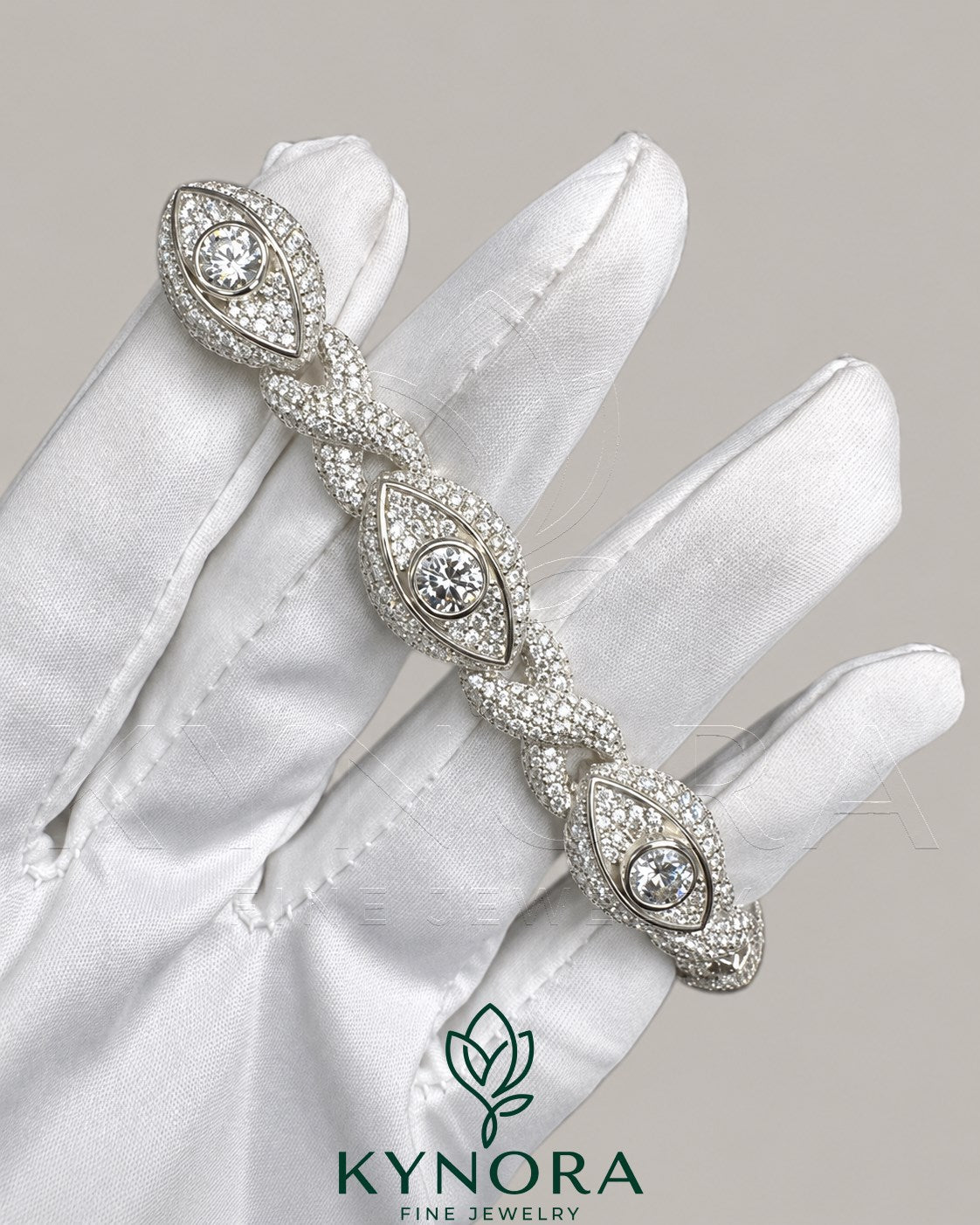 Silver men's hip-hop bracelet with infinity evil eye design featuring moissanite diamonds, crafted by Kynora Jewels.