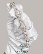 Men's silver hip hop bracelet with infinity evil eye and moissanite diamonds, crafted by Kynora Jewels.