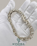 Kynora Jewels men's 10mm VVS moissanite round silver tennis bracelet, hip-hop style, showcasing sparkling stones and sleek silver design.