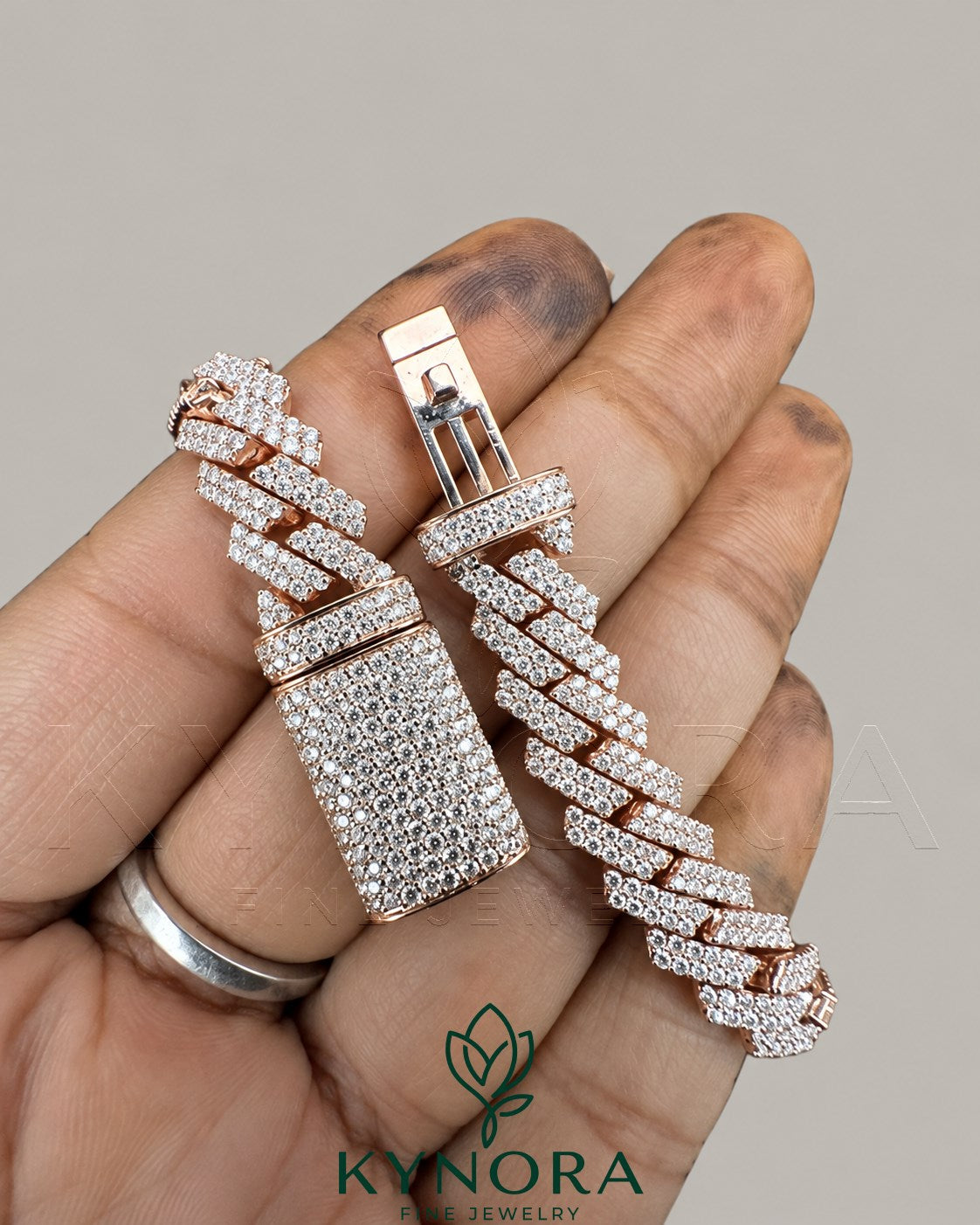 Men's 10MM iced-out 925 sterling silver moissanite Cuban bracelet by Kynora Jewels, showcasing a bold, sparkling hip-hop style jewelry piece.